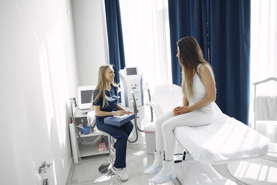 A healthcare professional consulting with a patient in a bright, modern clinic setting.